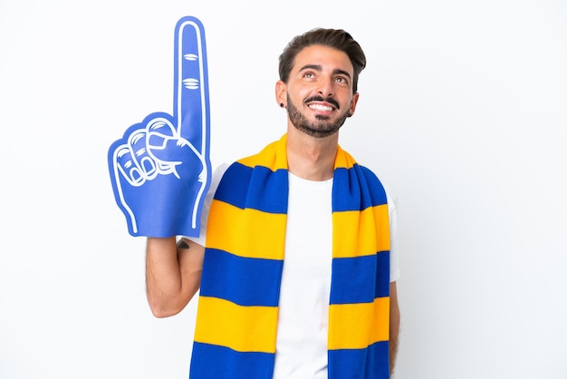 Young sports fan man isolated on white background thinking an idea while looking up