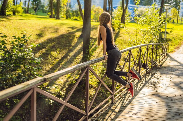 Young sports girl posing in the park