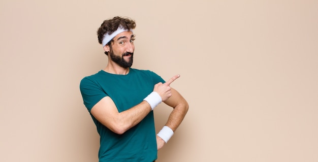 Photo young sports man expressing a concept on wall