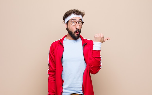 Young sports man on wall