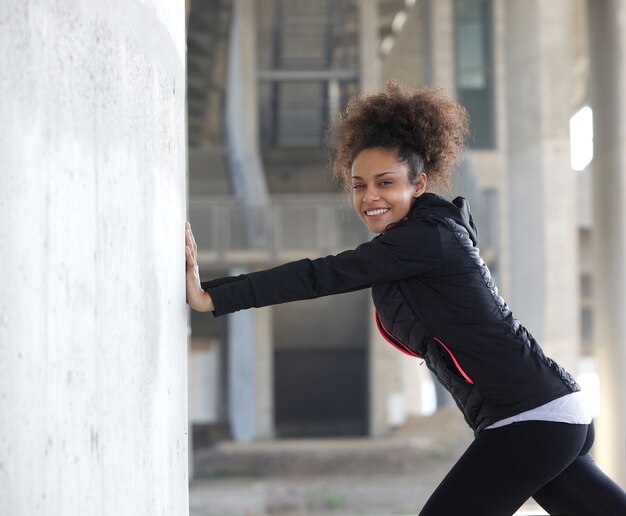 Young sports woman stretching exercise outdoors