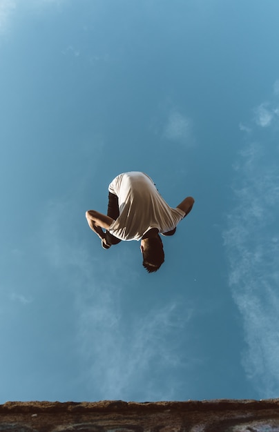 Young sportsman practicing parkour.