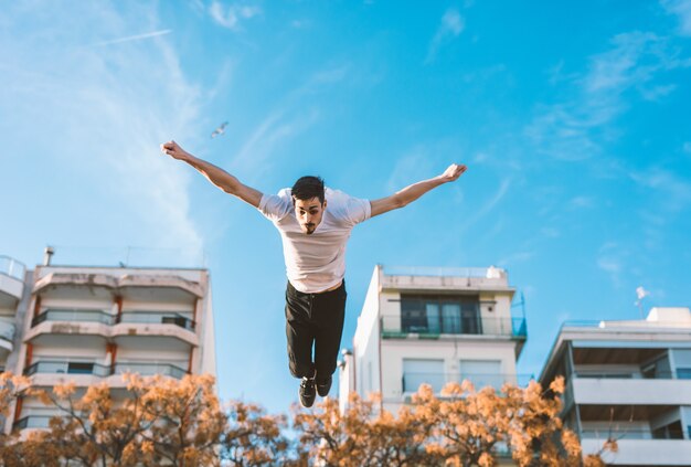 Young sportsman practicing parkour.