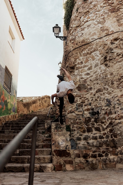 Young sportsman practicing parkour.