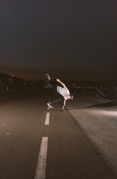 Young sportsman practicing parkour.