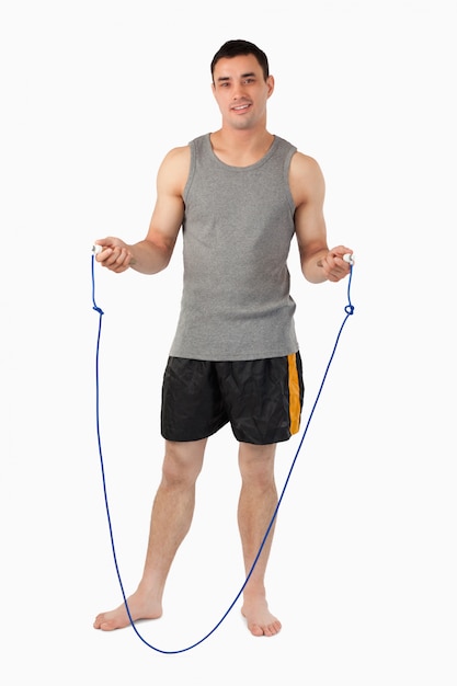 Young sportsman preparing for jump roping