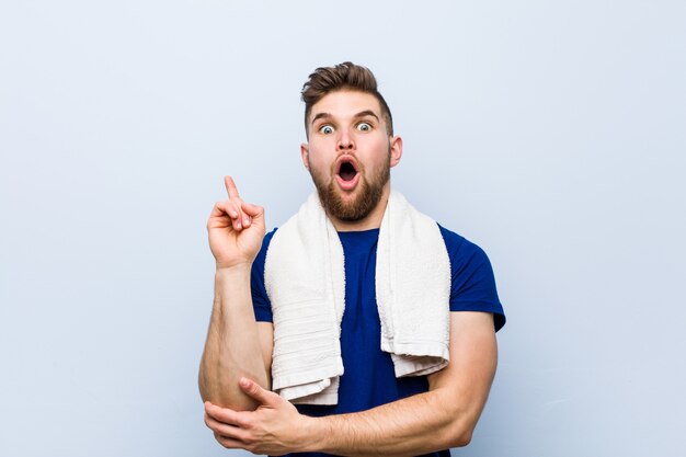 Young sportsman with a towel having some great idea