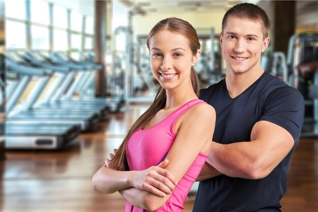 Young sporty couple in gym