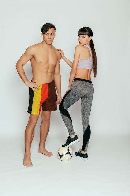 Young sporty couple in studio