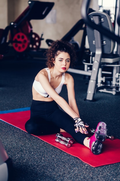 Young sporty woman doing exercises