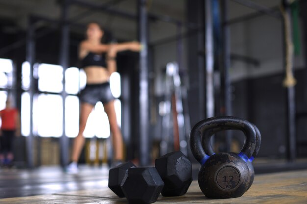 Young sporty woman stretching at the gym.