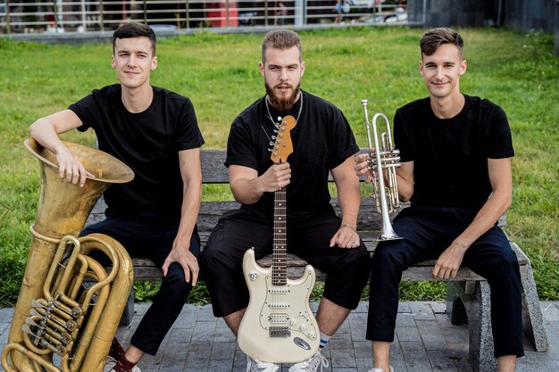 Photo young street music band play a lot of musical instruments