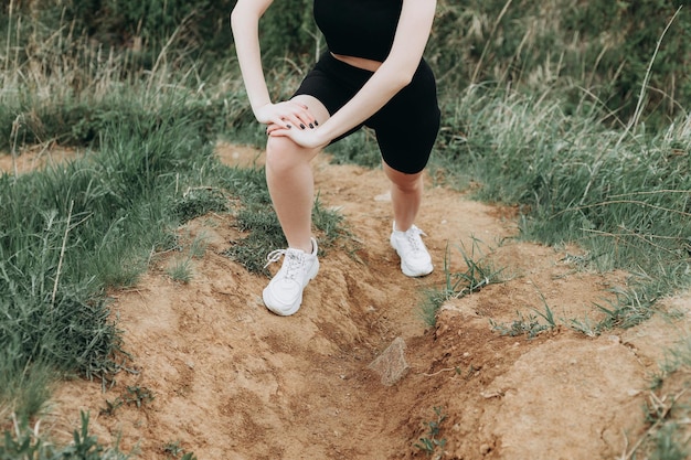 Young strong woman climbs to top of cliff overcoming obstacles\
and courage ambitious climber climb