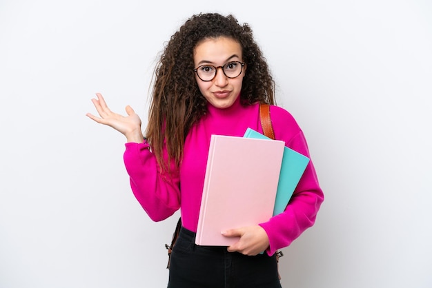 Young student Arab woman isolated on white background having doubts while raising hands