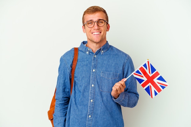 Young student caucasian man studying English isolated on white happy, smiling and cheerful.