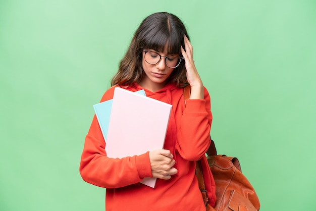 Photo young student caucasian woman over isolated background with headache