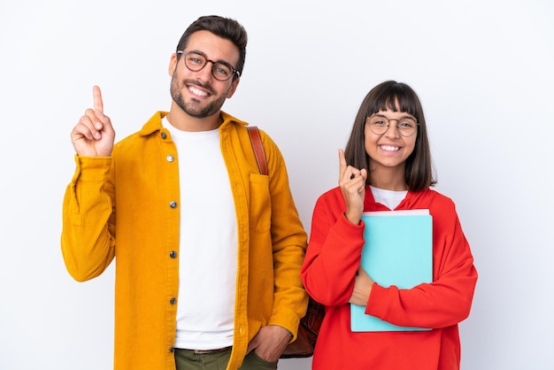 Young student couple isolated on white background showing and lifting a finger in sign of the best