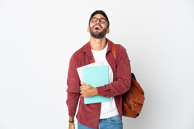 Young student man isolated on white background laughing