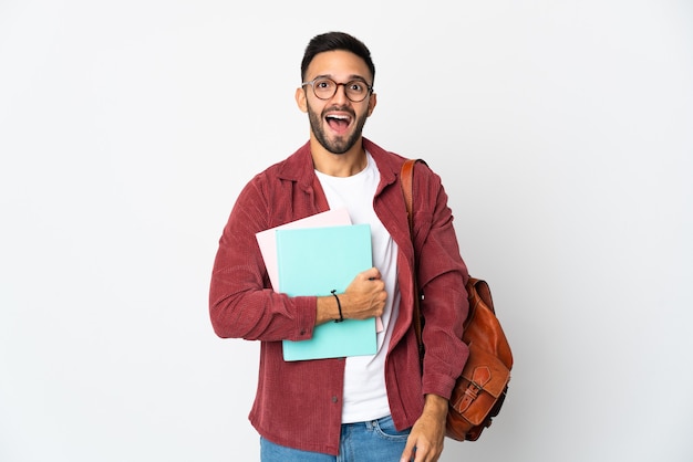 Young student man isolated on white background with surprise facial expression