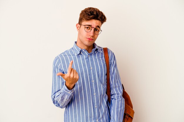 Young student man isolated on white wall pointing with finger at himself