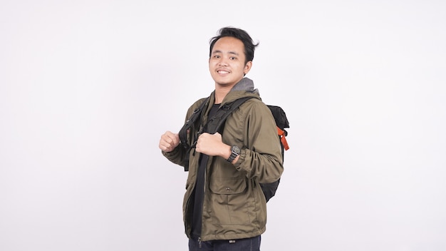 Young student man wearing a bag, isolated on white backgroud