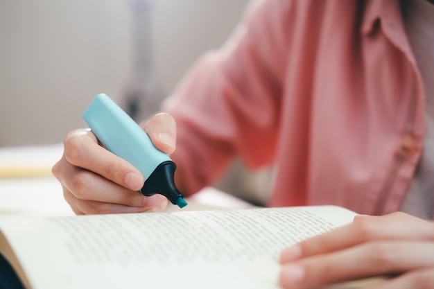 Young student reading a book