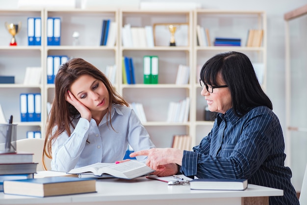 Young student and teacher during tutoring lesson