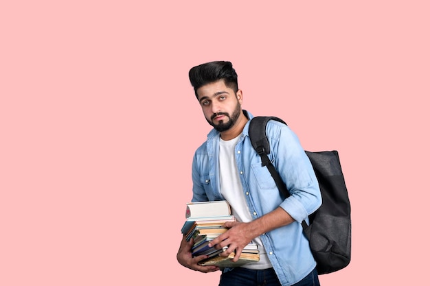 Young student with back pack holding books casual outfit indian pakistani model