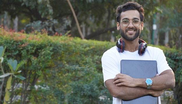 Young Student with laptop - man with laptop 