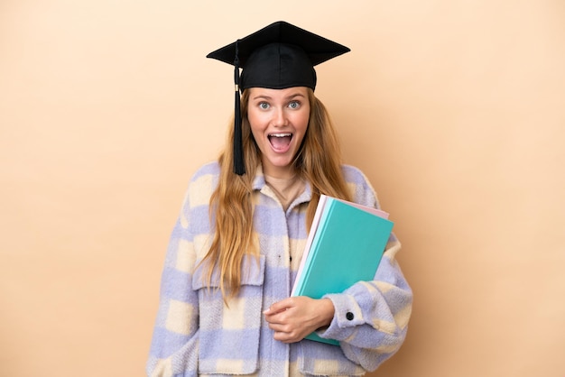 Young student woman over isolated background with surprise facial expression
