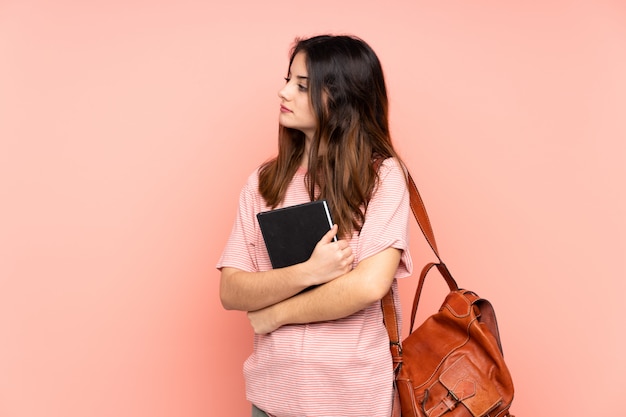 Photo young student woman over isolated wall