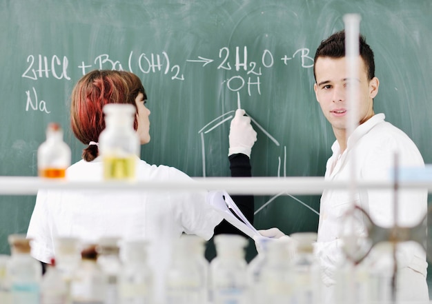 young students couple making test in bright labaratory