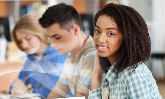 Young students studying on background