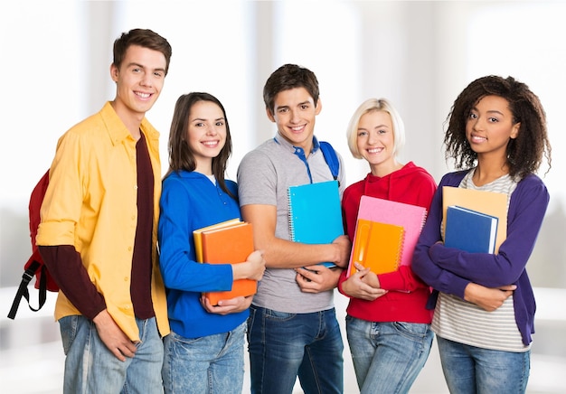 Young students studying on library background