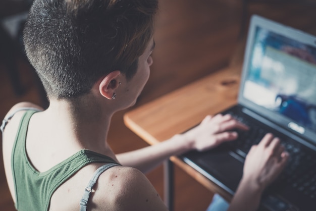 young stylish hair style woman using notebook