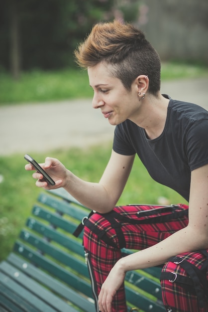 young stylish hair style woman using smart phone