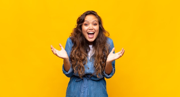 young stylish pretty woman on yellow background