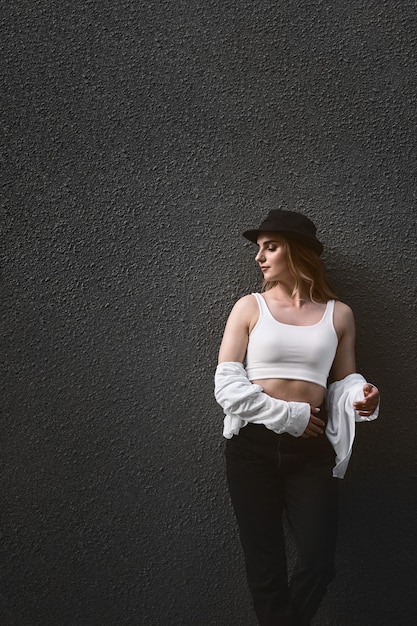 Young stylish woman posing outdoors