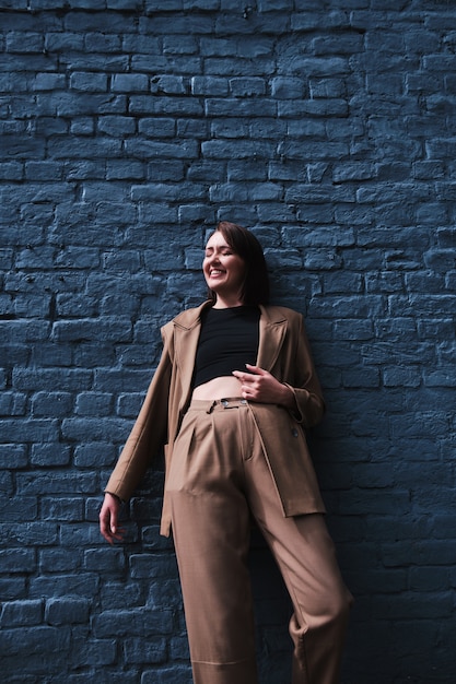 Young stylish woman posing outdoors