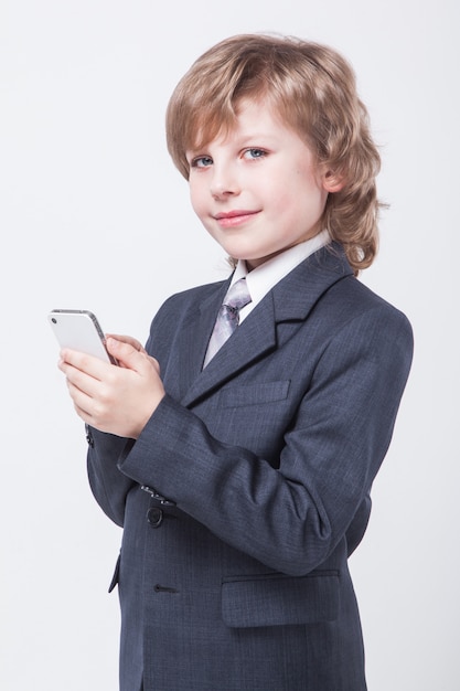 young successful businessman with mobile phone in hand is typing