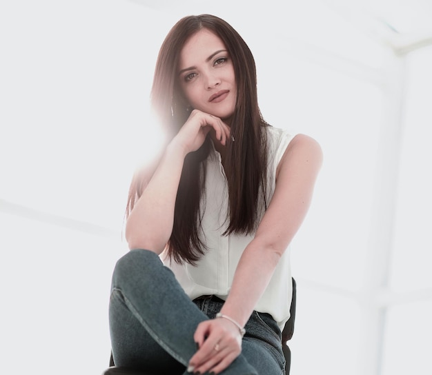 Young successful woman sitting in a chair