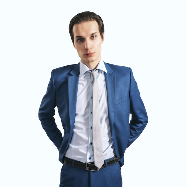 Photo young successfull businessman in blue suit and grey tie on light background close up