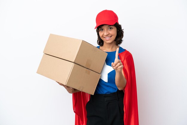 Young superhero delivery girl isolated on pink background showing and lifting a finger