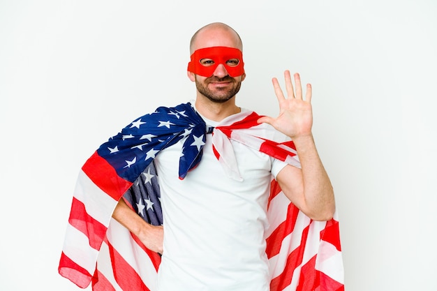 Photo young superhero man on white smiling cheerful showing number five with fingers.