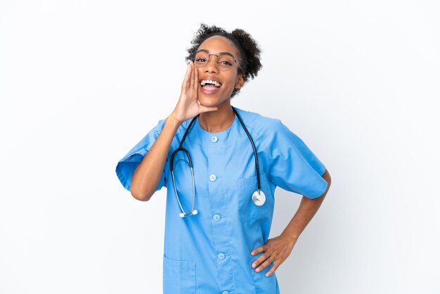 Young surgeon African American doctor woman isolated on white background shouting with mouth wide open