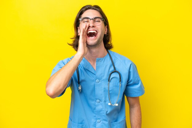 Young surgeon caucasian man isolated on yellow background shouting with mouth wide open