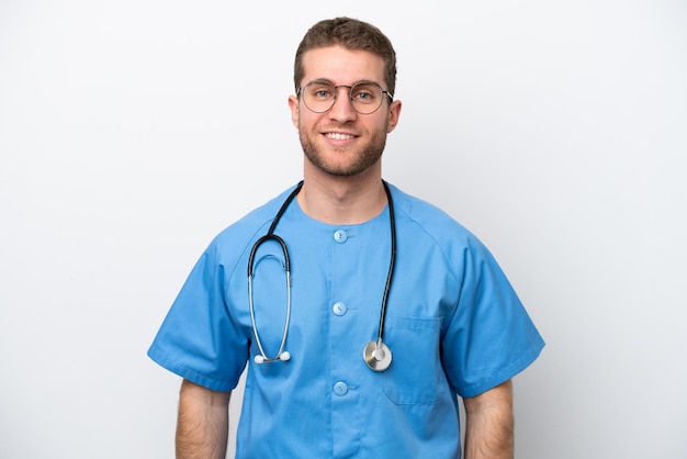 Young surgeon doctor caucasian man isolated on white background laughing