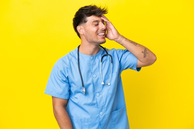 Young surgeon doctor man isolated on yellow background has realized something and intending the solution