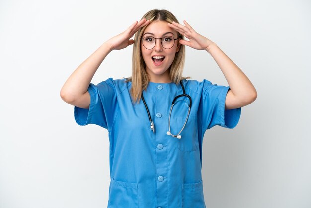 Young surgeon doctor woman isolated on white background with surprise expression