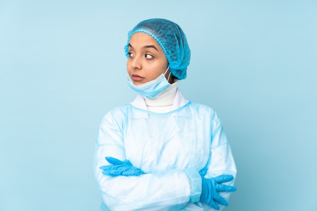 Young surgeon woman in blue uniform portrait